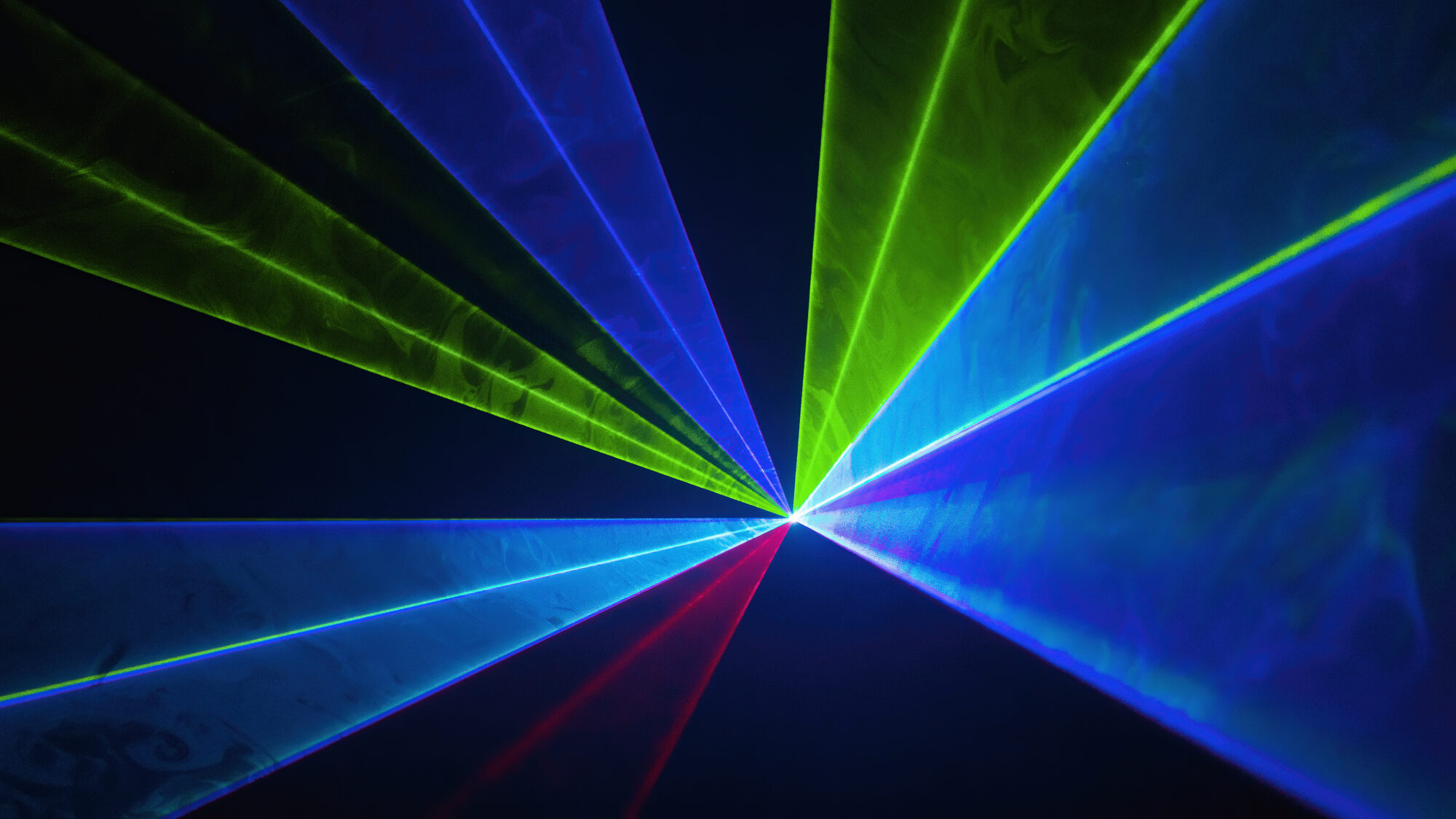 Green and blue laser beams radiating from a single point, Laser Spectacles